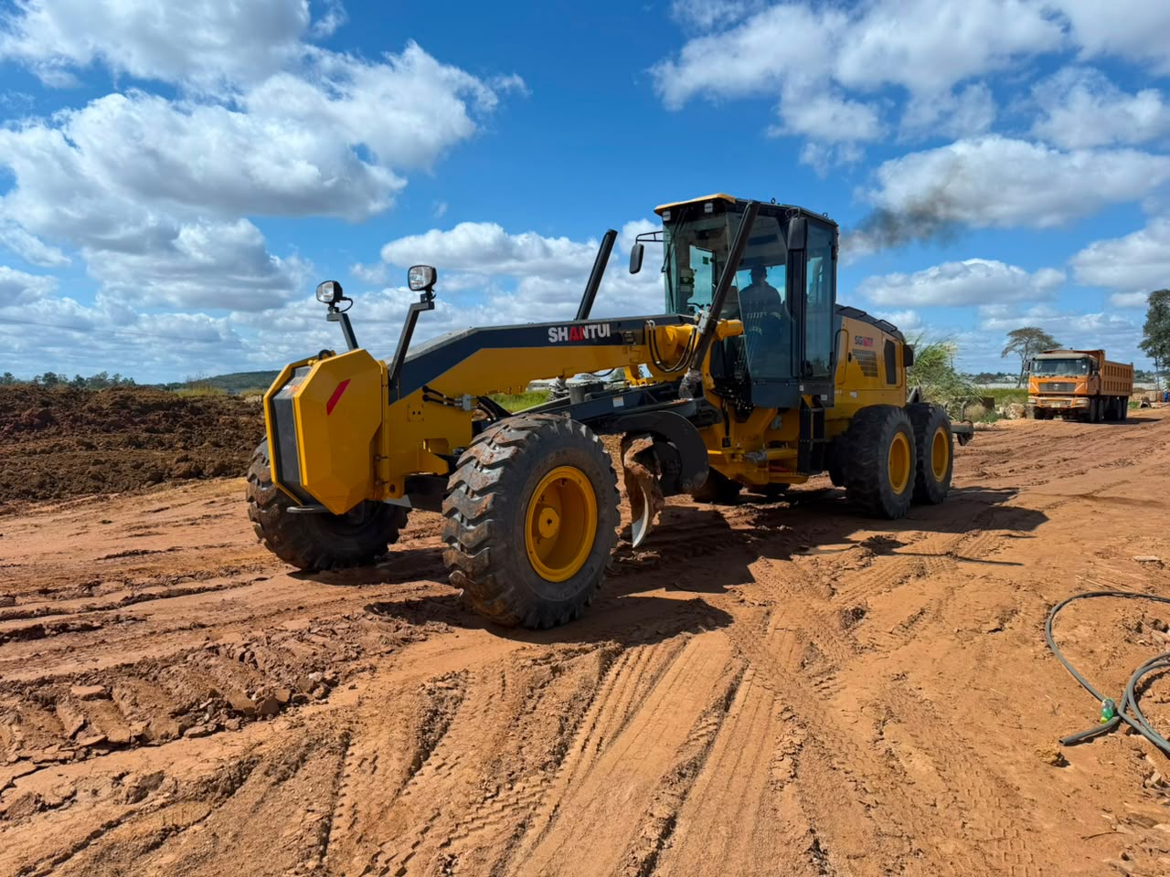 BMR grader on a levelled red-soil site