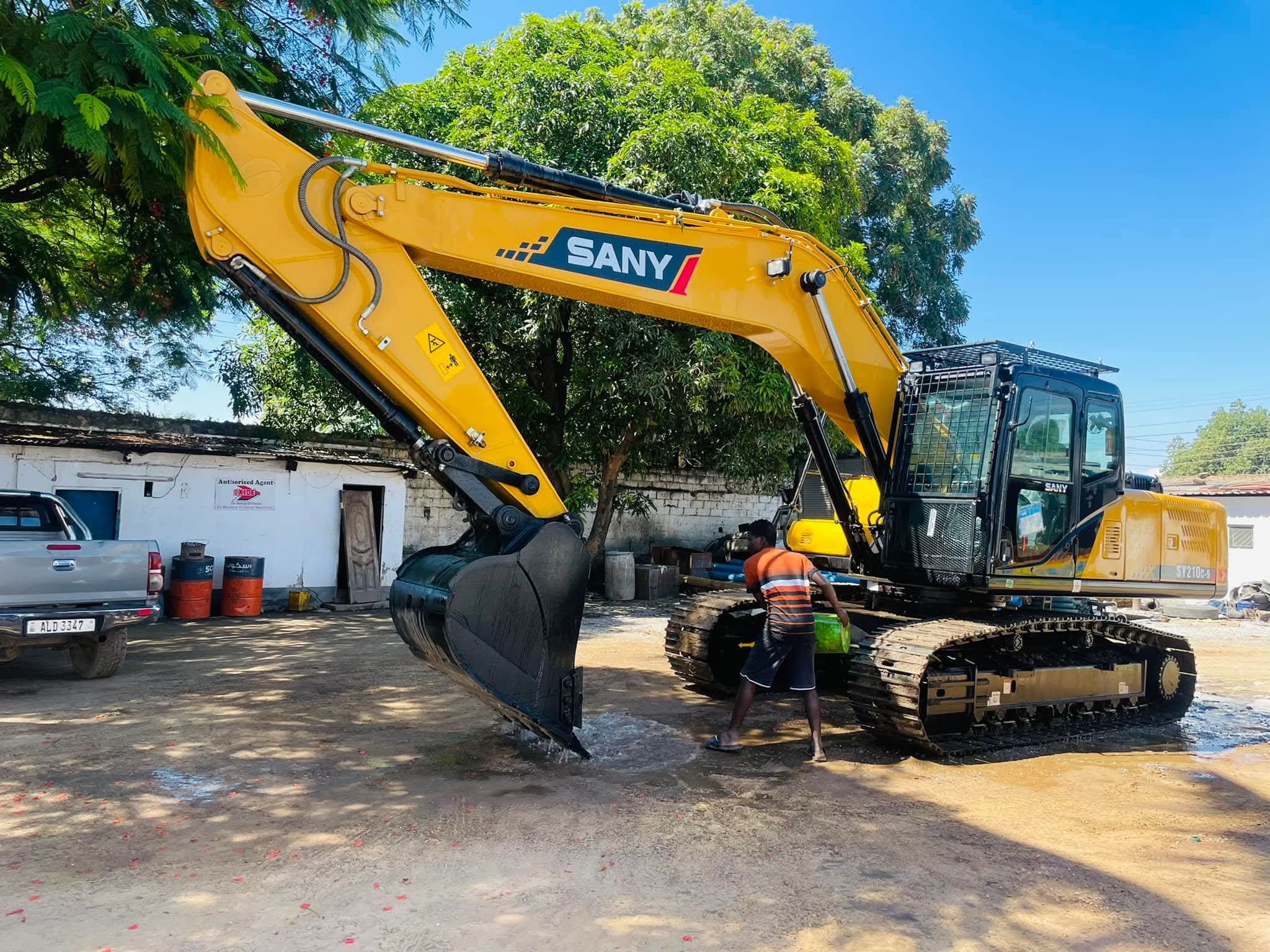 BMR excavator with operator in the yard